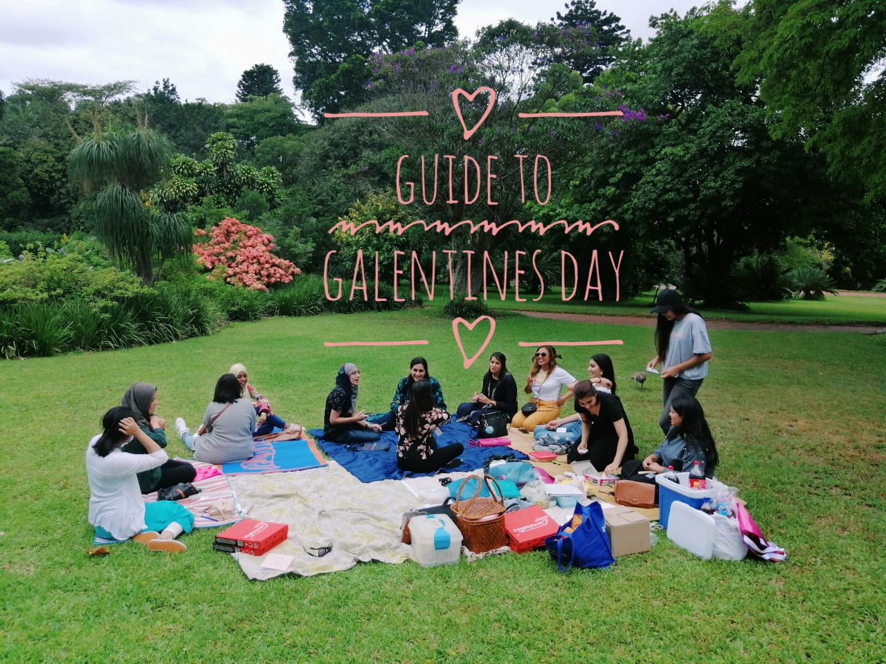 Galentines Day - a group of girl friends sitting in a circle at a park having a picnic